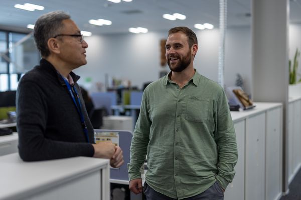 Two psychologists talking together in an office